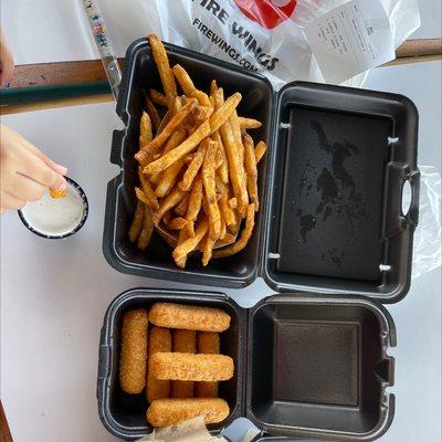 Season fries and mozzarella sticks