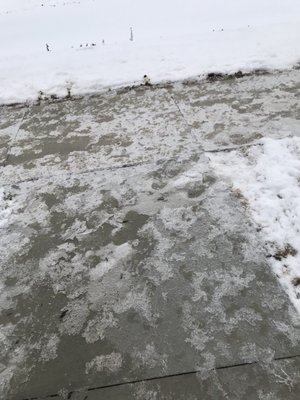 Untouched icy sidewalks in winter. Same as the actual parking lot; untouched.