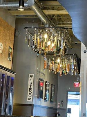 Hanging taps were really cool way to store them & tells you how many different beers they rotate