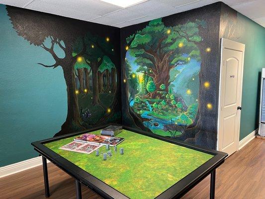 Mural wall and gaming table. Available for free play!