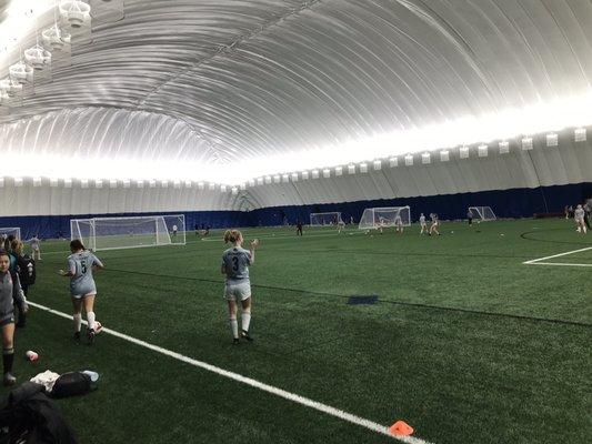 HUGE indoor turf under the big white bubble.