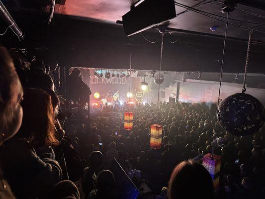 View of crowd from stairs to bar