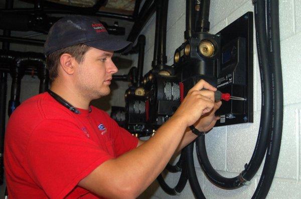 Service Technician, Jared working on installing a new Geothermal system!