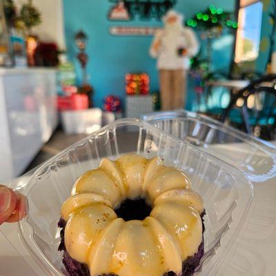 UBE Flan Cake with Cuban Santa watching.