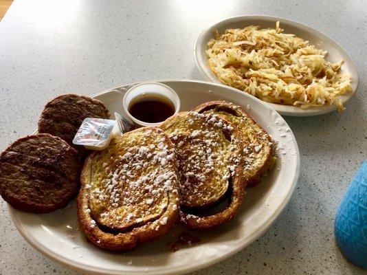 Delicious cinnamon swirl French toast, sausage, and hash browns.