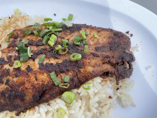 Blackened catfish with rice and scallions