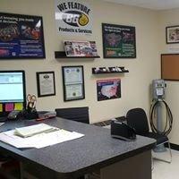 Waiting area with glass viewing door into the shop