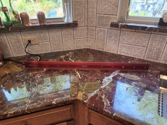 A great overview of our marble countertops, which we were lied to that were GRANITE for months