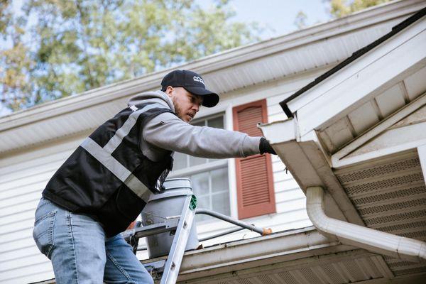 The Gutter Boys installing gutters