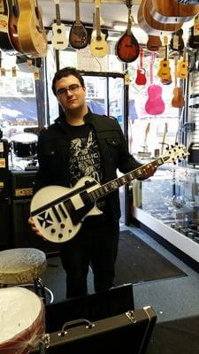 Karl picking up his new ESP LTD Iron Cross Guitar