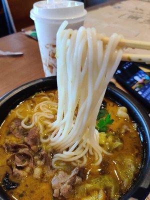 Golden pickled beef sliced rice noodle soup