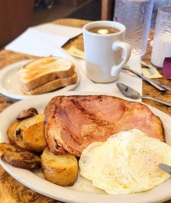 Ham steak substitute fried potatoes for hash browns white toast eggs over medium cawfee. Get your yummers on!