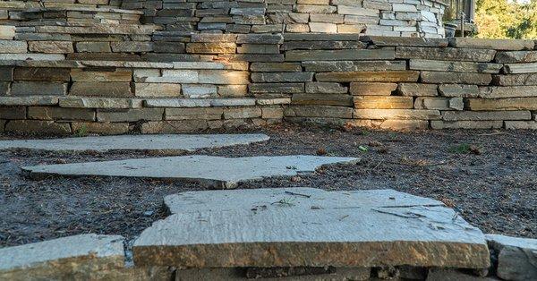 stepping stones and the front face of the stack stone retaining walls