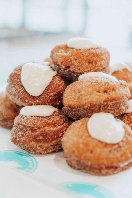 Daily doughnut rolled in cinnamon sugar w/ buttercream icing