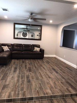 Recess LED dimmer lights put in ceiling fan and did tile that looks like wood