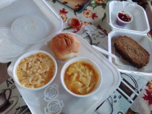 Meatloaf with ketchup sauce 2 sides (au gratin potatoes and mac n cheese)and fresh roll