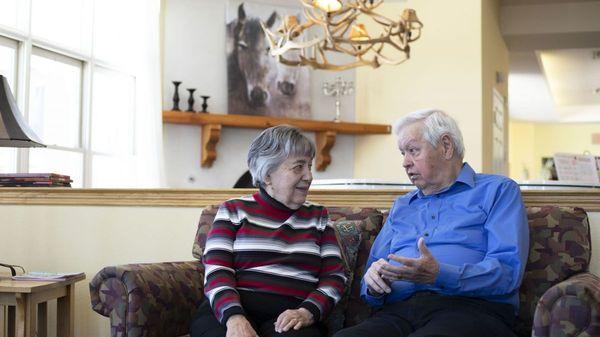 Couple Sitting in Shared Living Area | Kingston Residence of Santa Fe