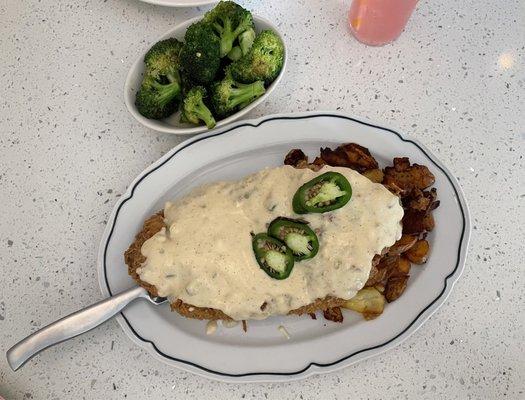 Pistachio crusted chicken fried steak and side of broccoli