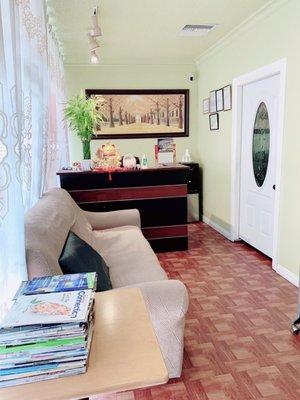 Front desk reception area with couch