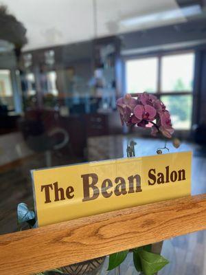 The Bean Salon suite entrance window