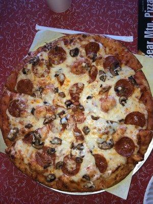 Large pepperoni extra cheese an Mushroom