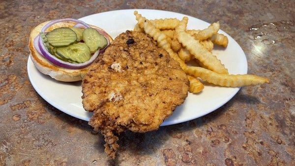 Breaded pork tenderloin and fries.