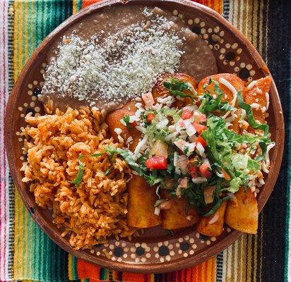 Chicken Enchiladas served with rice and beans