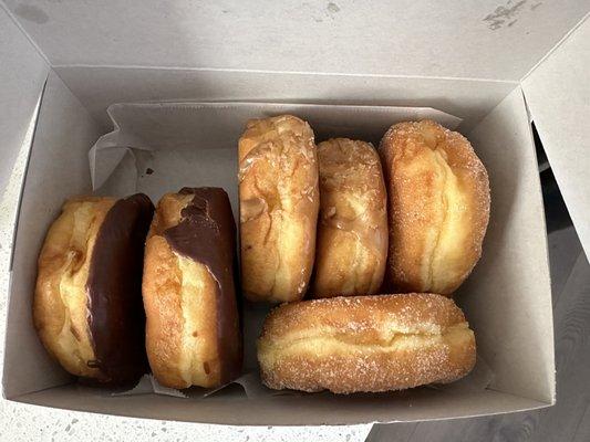 Half a dozen donuts; 2 chocolate-raised, 2 maple-raised, and 2 sugar-raised  $1.50 each, $10 for 1/2 dozen, or $19 for a dozen