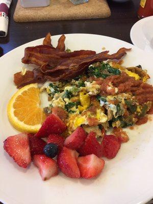 Breakfast. Whole egg omelet, all veggies, extra spinach, plus jalapeños, no cheese, topped with homemade salsa.