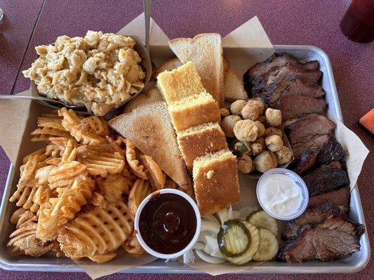 Brisket family meal with waffle fries and Mac and cheese