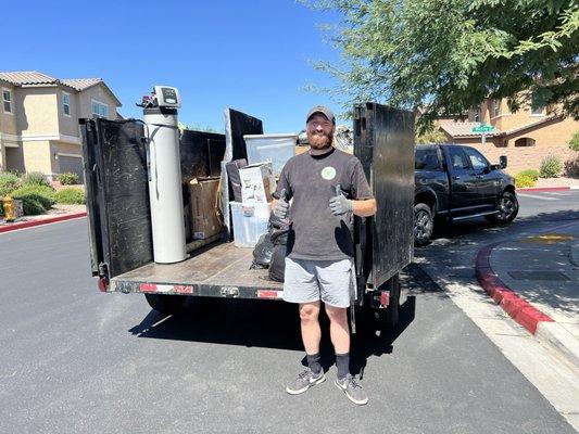 Zach, owner of Junk Monsters, hard at work and with a smile!