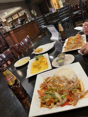 Papas a la huancaina, tostones, veggie saltado and chaufa de camarones with cusqueña beer.