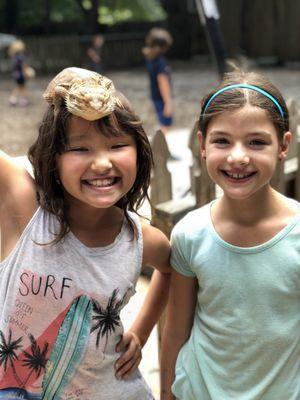 Lower Elementary students and the class pet, Spike.