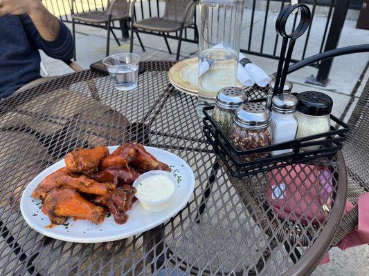 Wings - half Buffalo, half bbq. Saucy, tender, crisp. Cute patio table too.