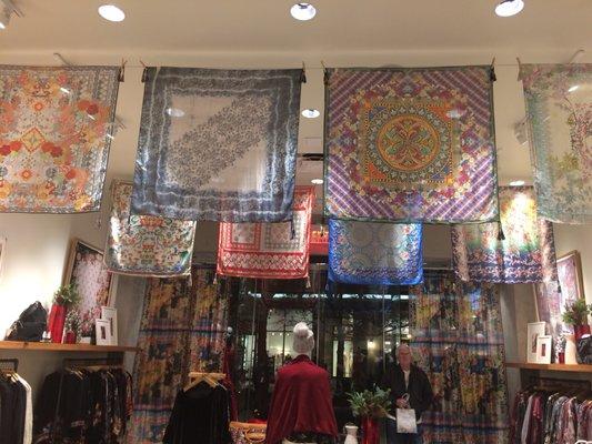 The scarves are displayed above