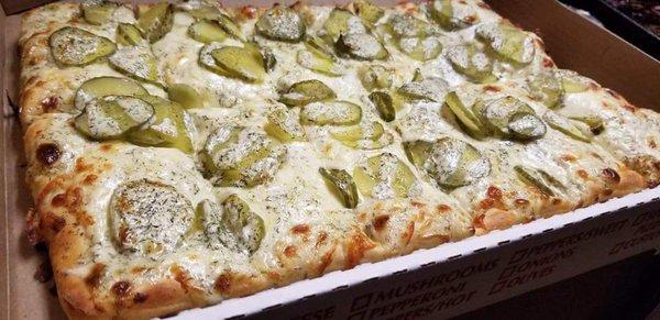 Dill Pickle Ranch Pizza made with their housemade ranch dressing.