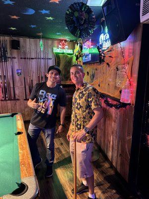 John and Jose playing pool.