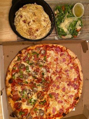 Half Hawaiian half supreme za and spaghetti carbonara with arugula salad.