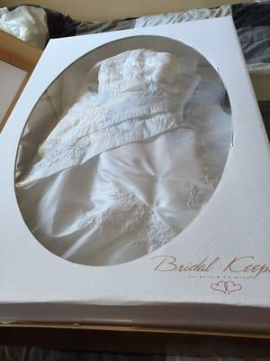 Wedding dress, pressed and cleaned in a tidy box for long term storage