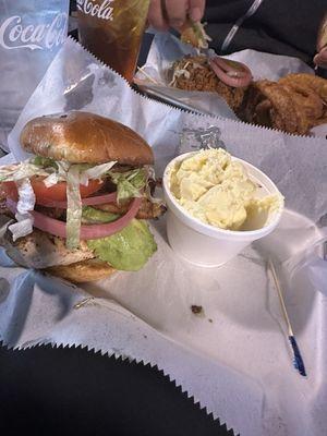 Grilled Cali chicken sandwich w/potato salad & pork tenderloin sandwich with onion rings