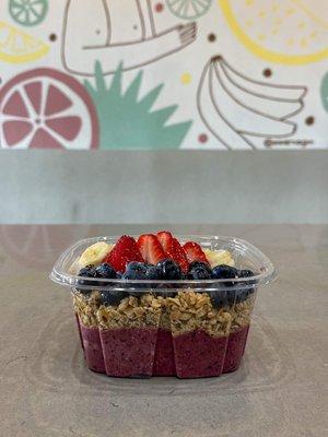 Our açaí bowl! With a base of strawberry, banana, blueberry, and açaí topped with hempseed granola, banana, strawberry, and blueberries!