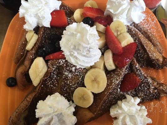 Look at the bananas, strawberries and blueberries! And dollops of fresh whipped cream.