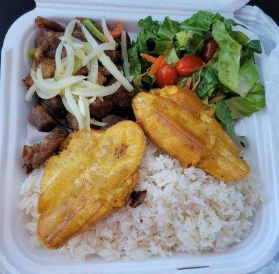 Griot (fried pork) with white rice and plantains (It also came with bean sauce, pikliz, and sos.)