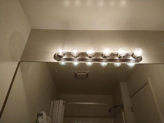 These vanity lights in the bathroom could cook biscuits a foot away. I can feel heat radiating from about 4 feet away.