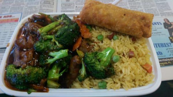 Spicy beef dinner with egg roll.