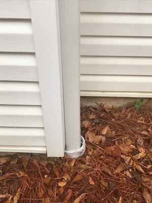 We bought the PVC pipe and joints for our buried gutter downspouts, and it looks a million times better than black corrugated plastic.