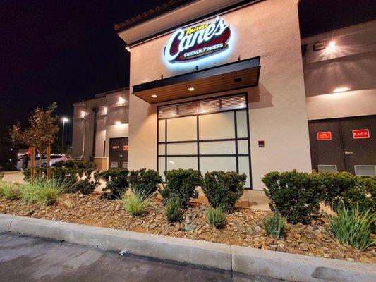 Raising Cane's restaurant at night.