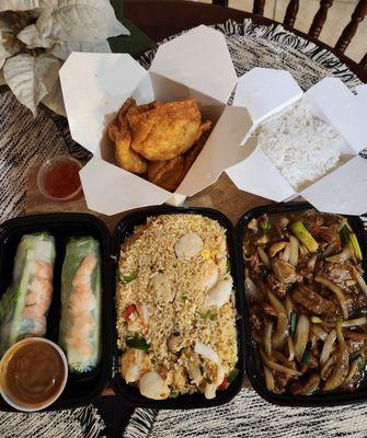 Vietnamese spring rolls, crab rangoons, Malaysian seafood fried rice, and Mongolian beef