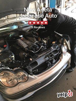 Tommy tuning up my car, the most honest mechanics in the valley.