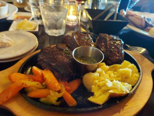 Lamb loin chops with carrots and rosemary potatoes.